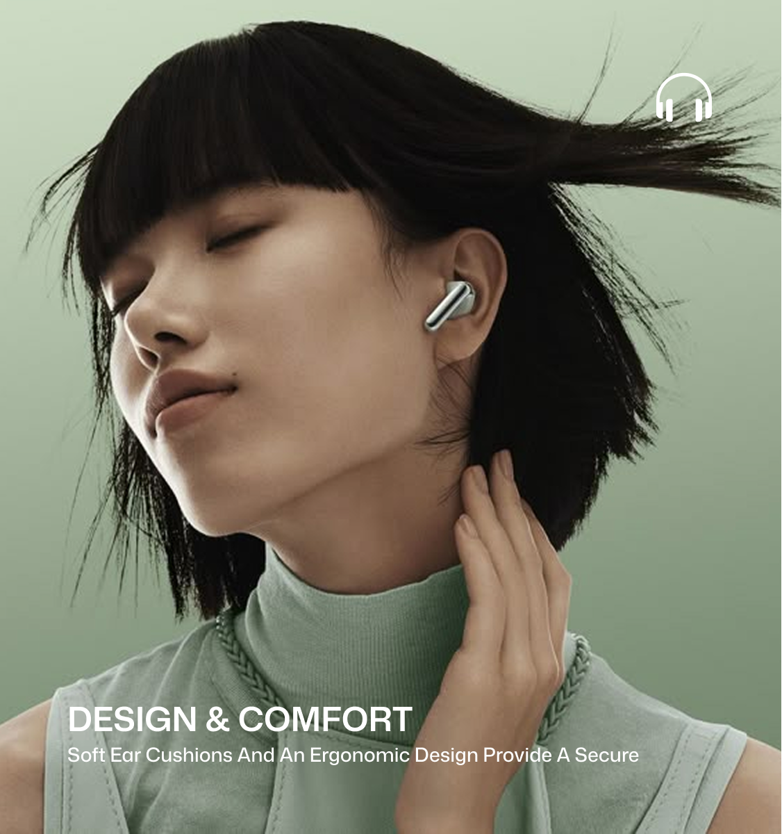A woman with short dark hair wearing a silver wireless earbud, shown in a close-up portrait against a soft sage green background. Text at the bottom reads 'DESIGN & COMFORT' with smaller copy about ear cushions and ergonomic design, and a small headphone icon appears near the top right.