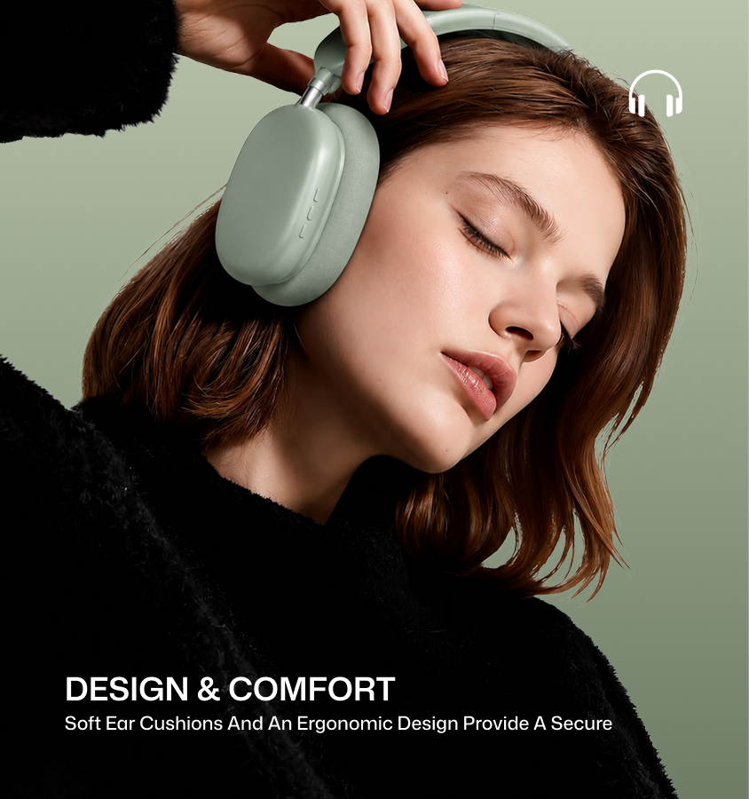A woman wearing a sage green over-ear wireless headphone, with her hand resting on the earcup. She is dressed in a black fuzzy sweater against a matching sage green background.