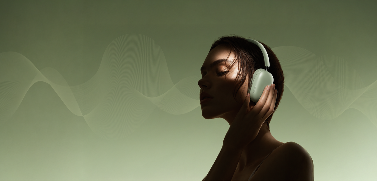 A woman in profile wearing white over-ear headphones against a soft green background with wavy soundwave lines.