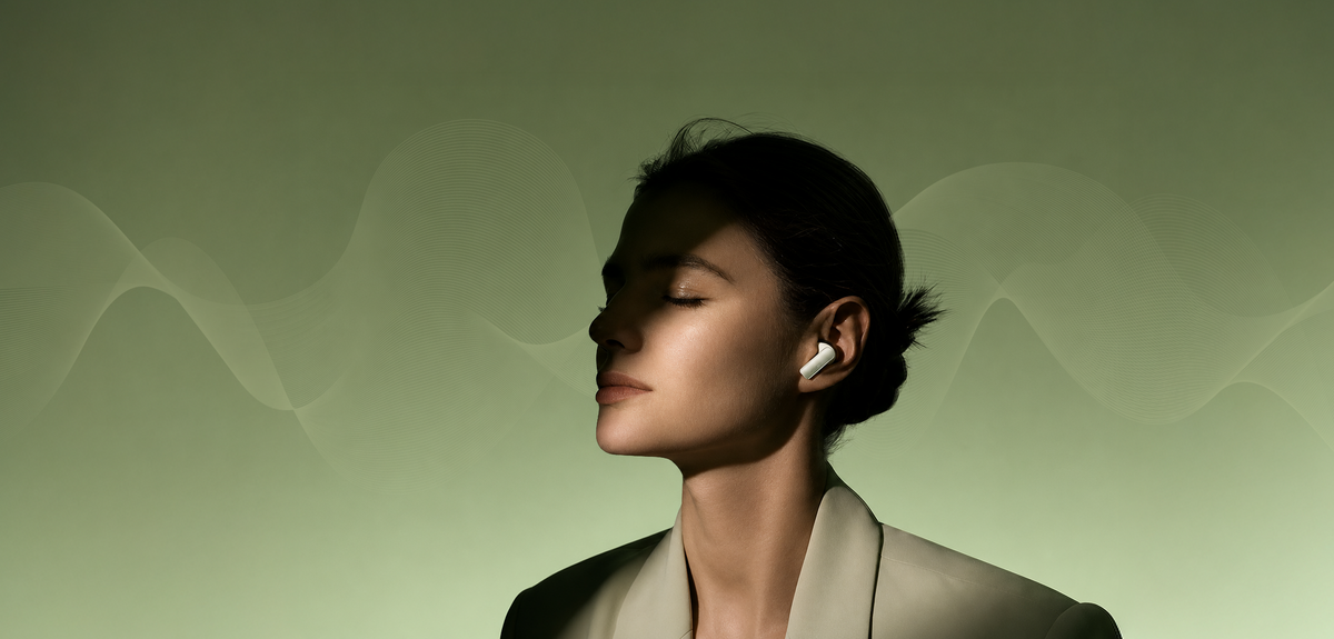 A woman in profile wearing a white wireless earbud, set against a soft olive-green background with abstract wave patterns.
